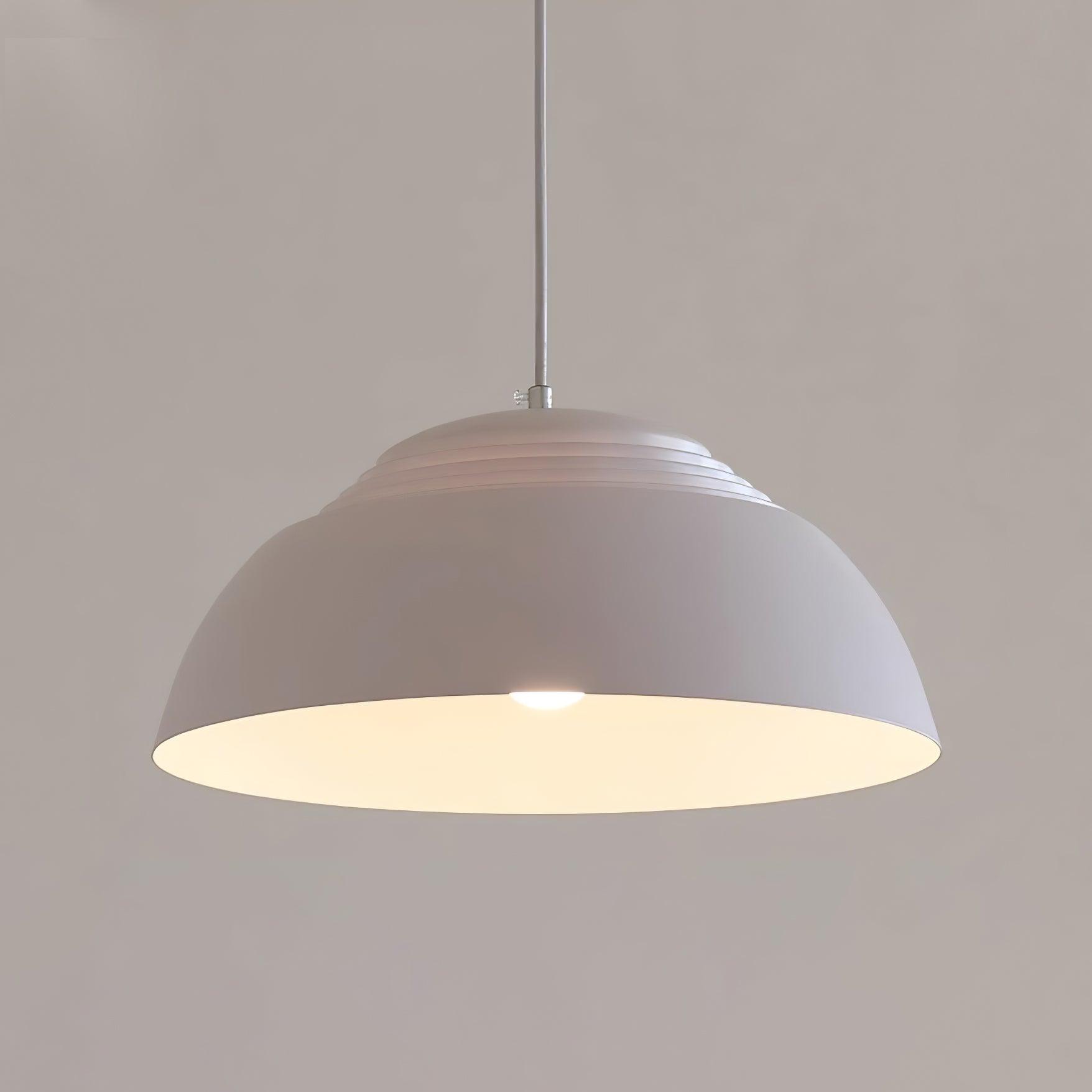 Vantara ridged aluminium pendant light in matte black with warm LED bulb glow