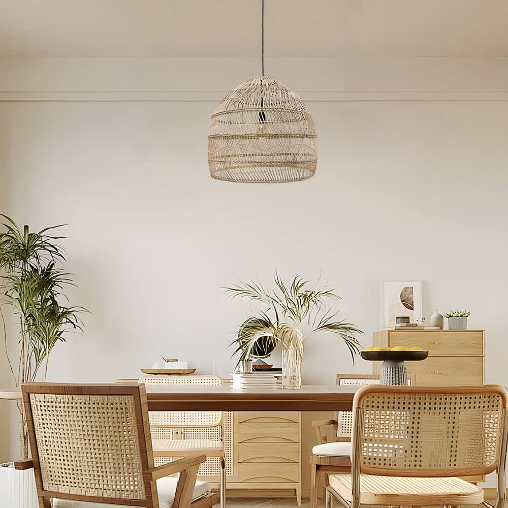 Aureon rattan pendant light in natural finish casting warm ambient light in a dining room setting