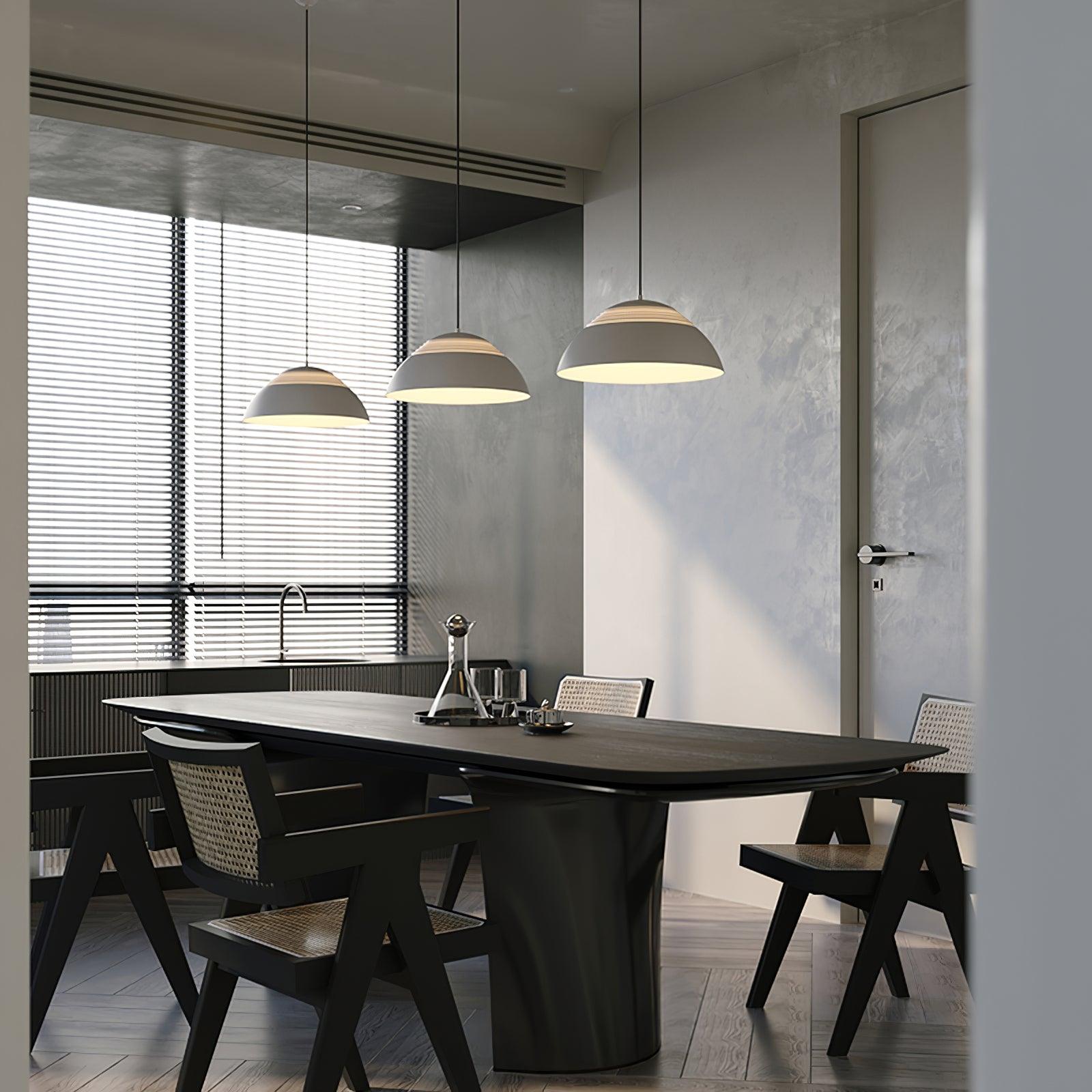 Vantara small 37.5 cm pendant light in matte black above a reading nook in a modern interior
