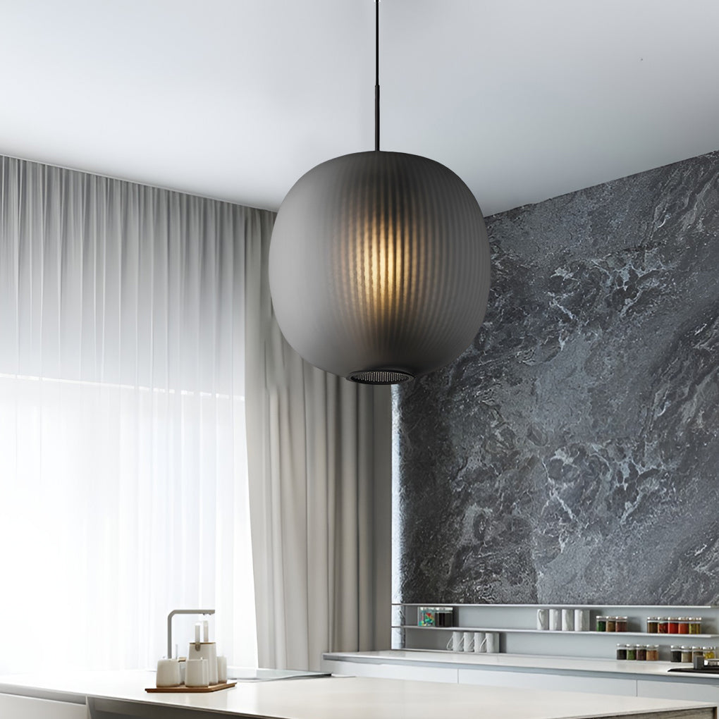Close-up of Aureon glass lantern pendant light, showing round silhouette and glass construction