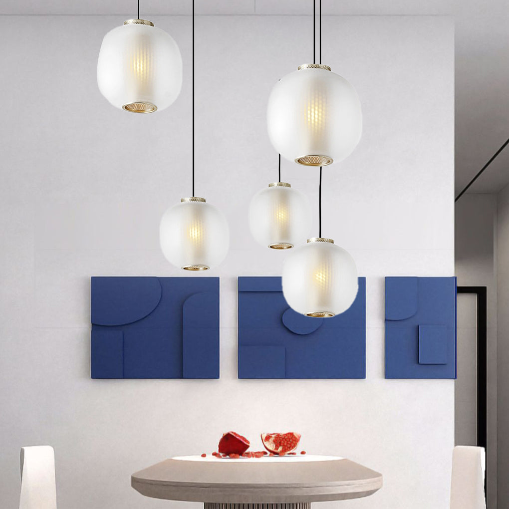 Aureon glass pendant light styled in a contemporary dining room, black finish