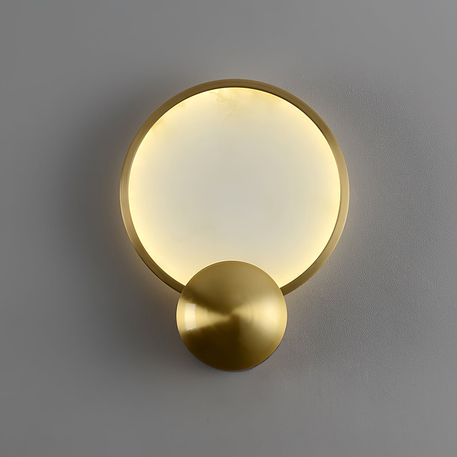 Sayo Sayo wall light with brushed gold frame mounted in a Japandi bedroom interior