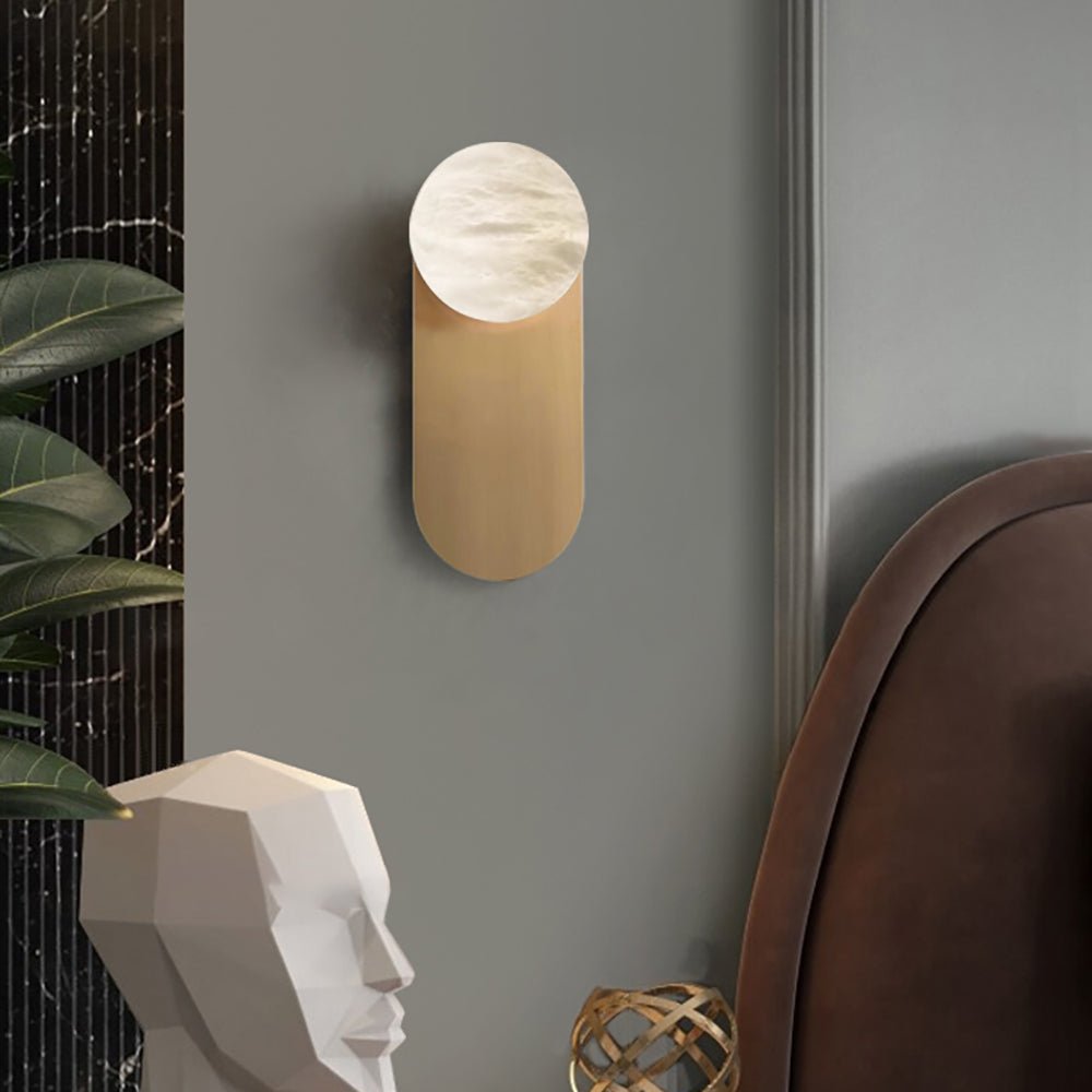 Savio Savio Wall Sconce casting soft warm light in a minimal hallway interior