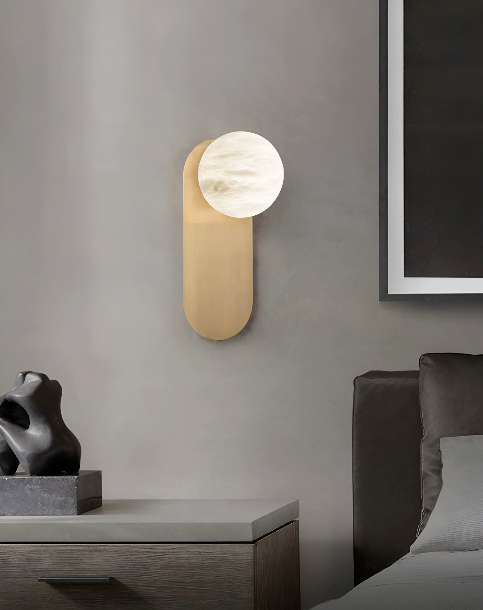 Savio Savio Wall Light lit in the evening showing warm amber light tone