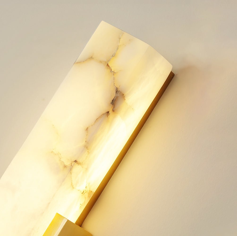Iwara Iwara Wall Light in black finish in a dark, moody bedroom interior