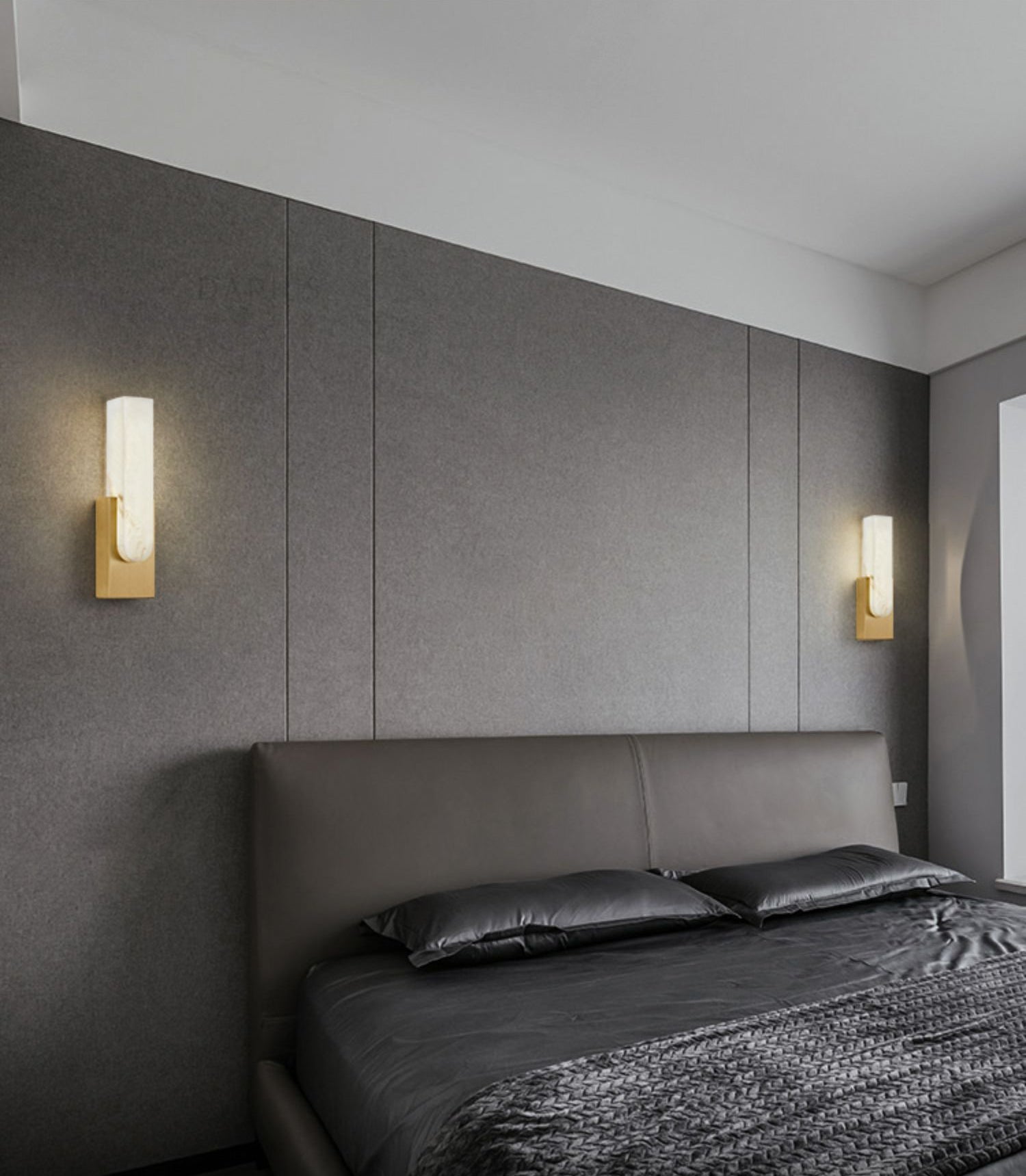 Iwara Wall Light in neutral white 4000K setting showing even stone diffusion on a plain wall