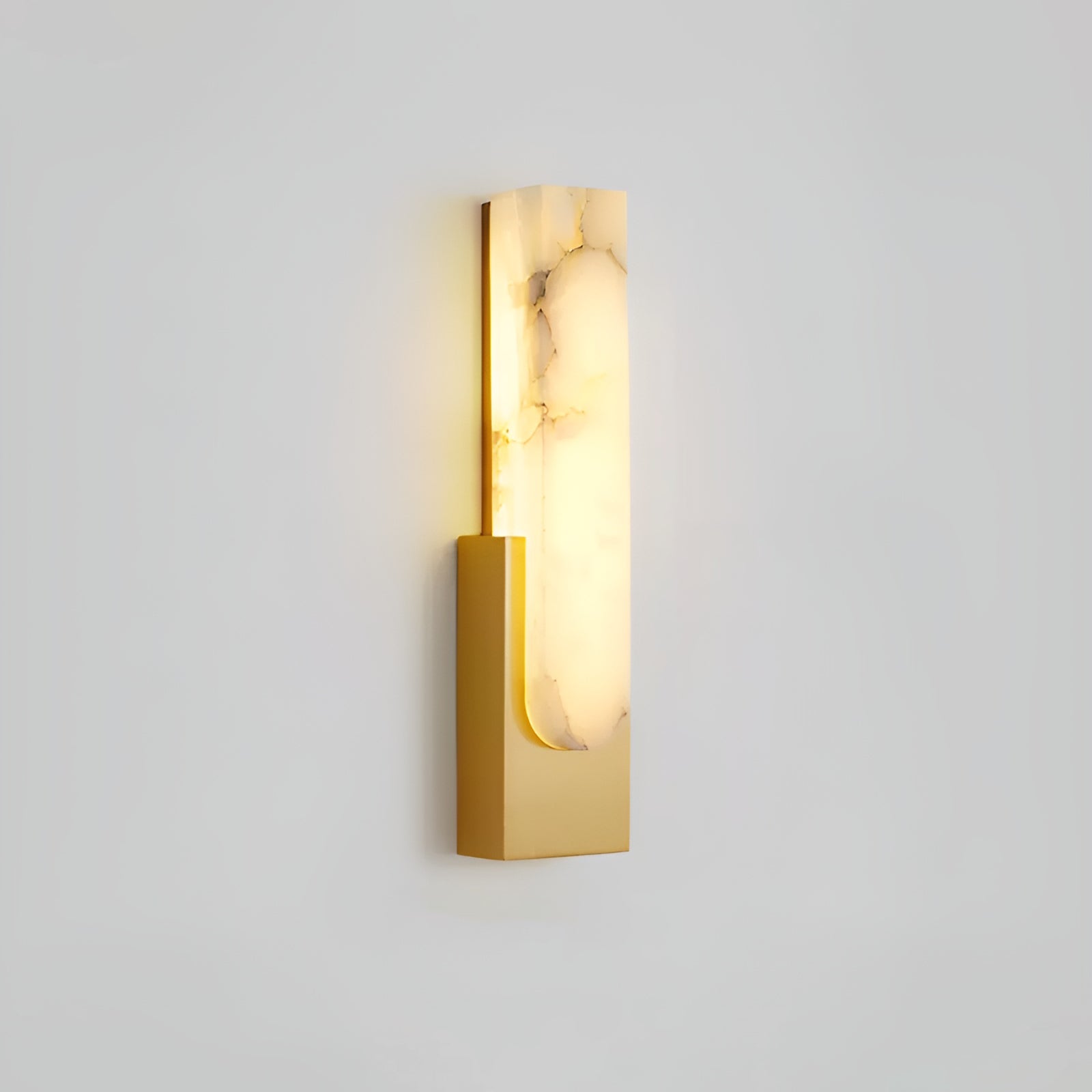 Iwara Iwara Wall Light in copper finish mounted on a pale wall in a Japandi bedroom