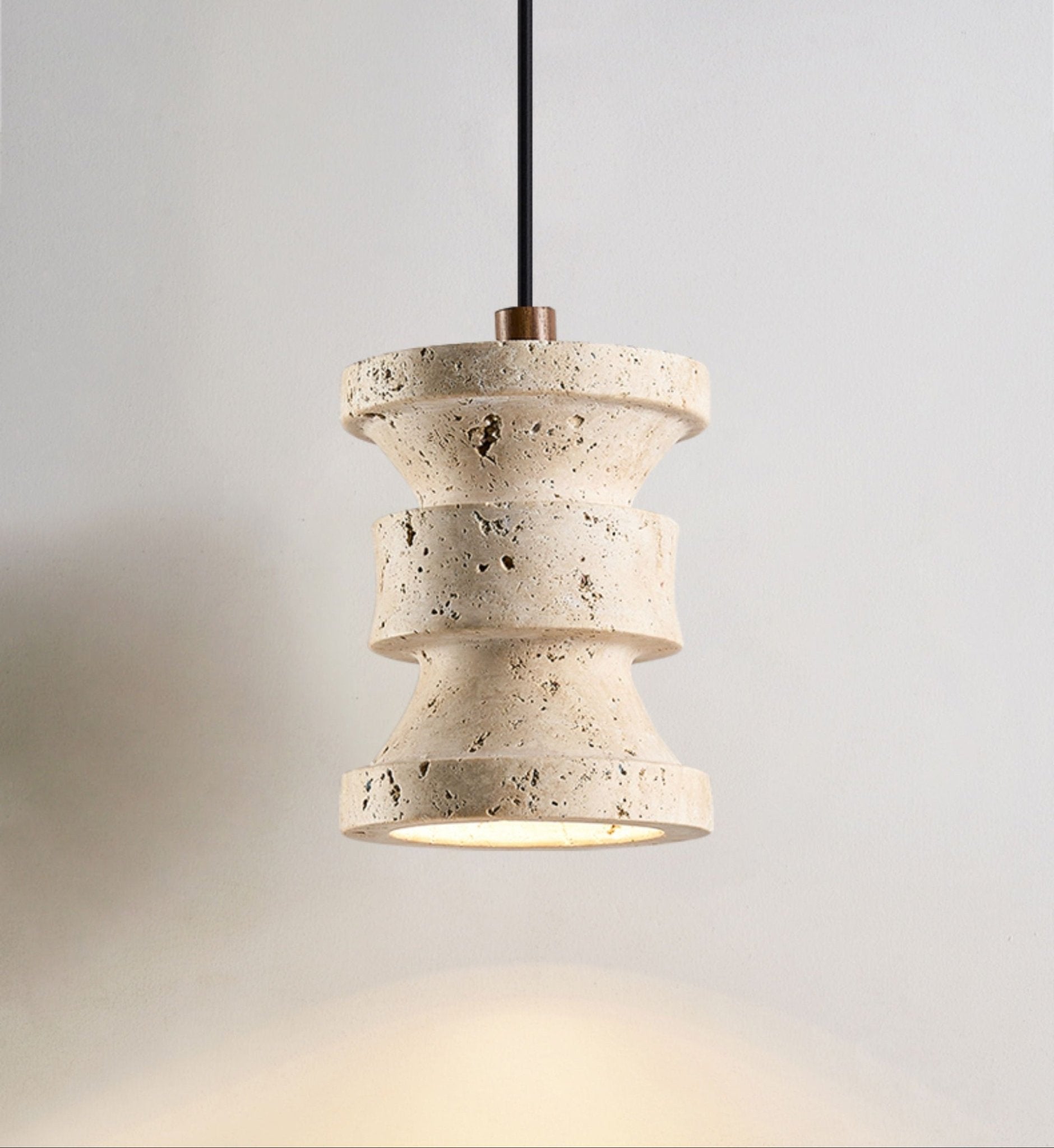 Close-up of natural yellow travertine texture on the Kasena stone pendant light