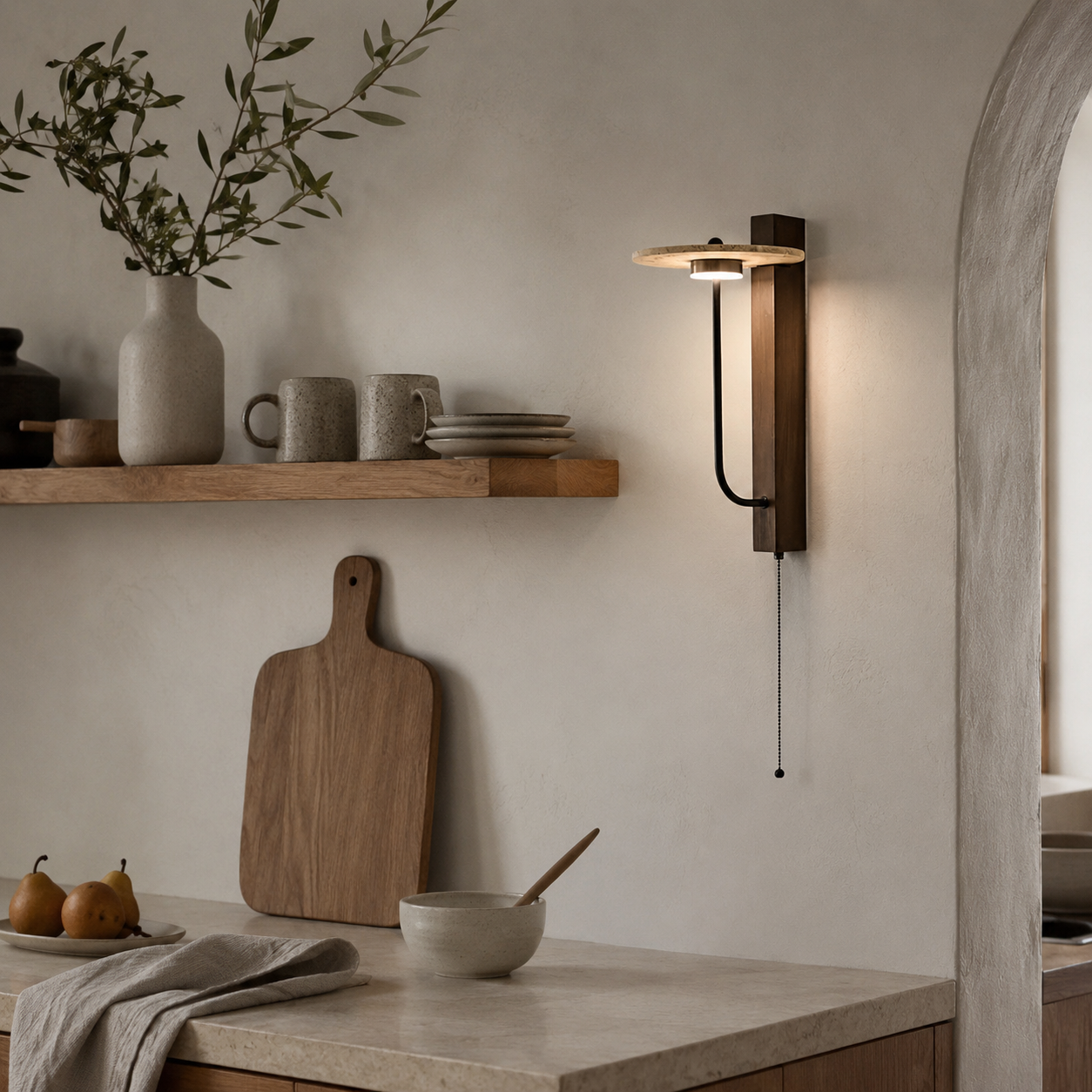 Small size Sumi travertine wall light beside a bed in a Japandi styled bedroom