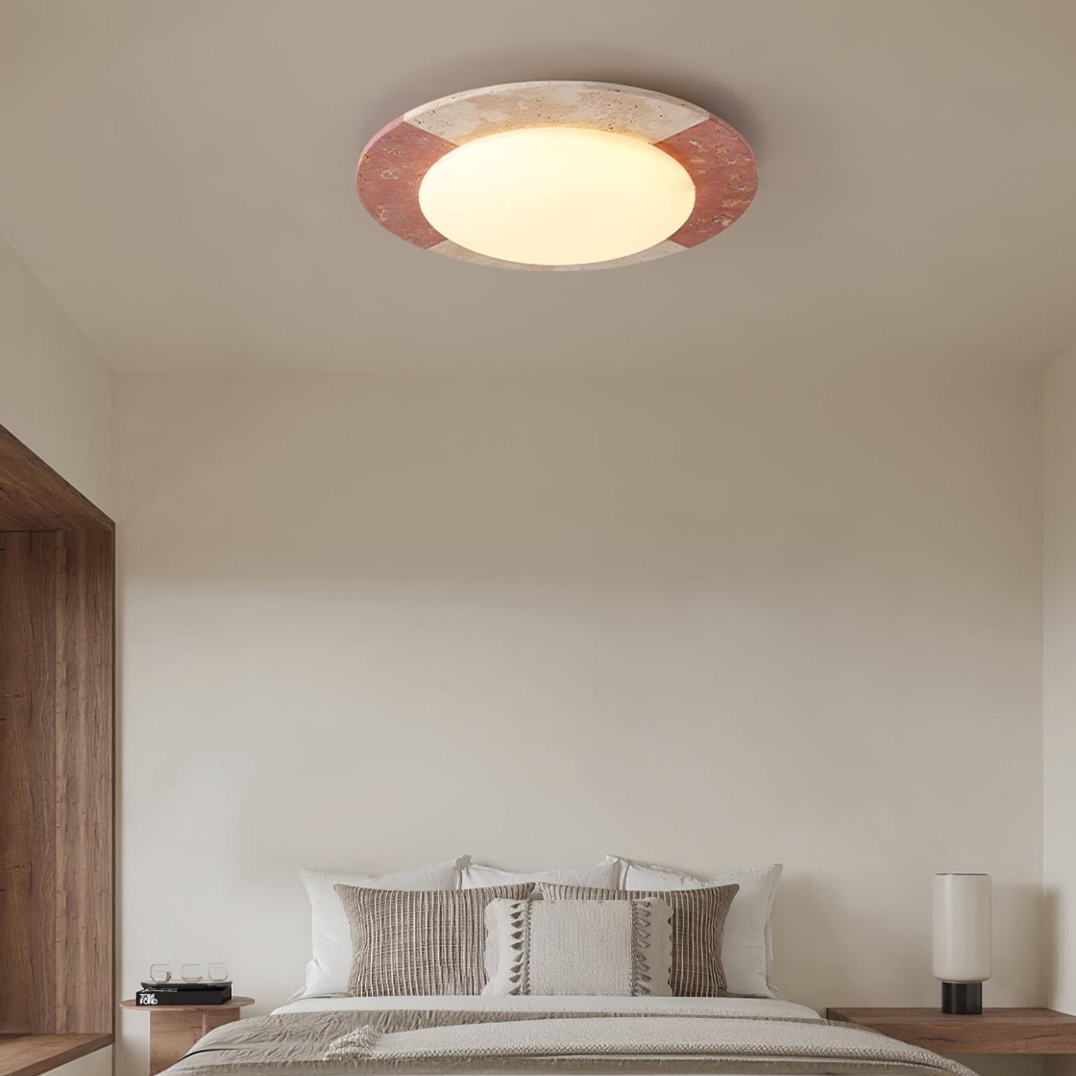 Stone ceiling light with beige and red-brown frame against a white ceiling