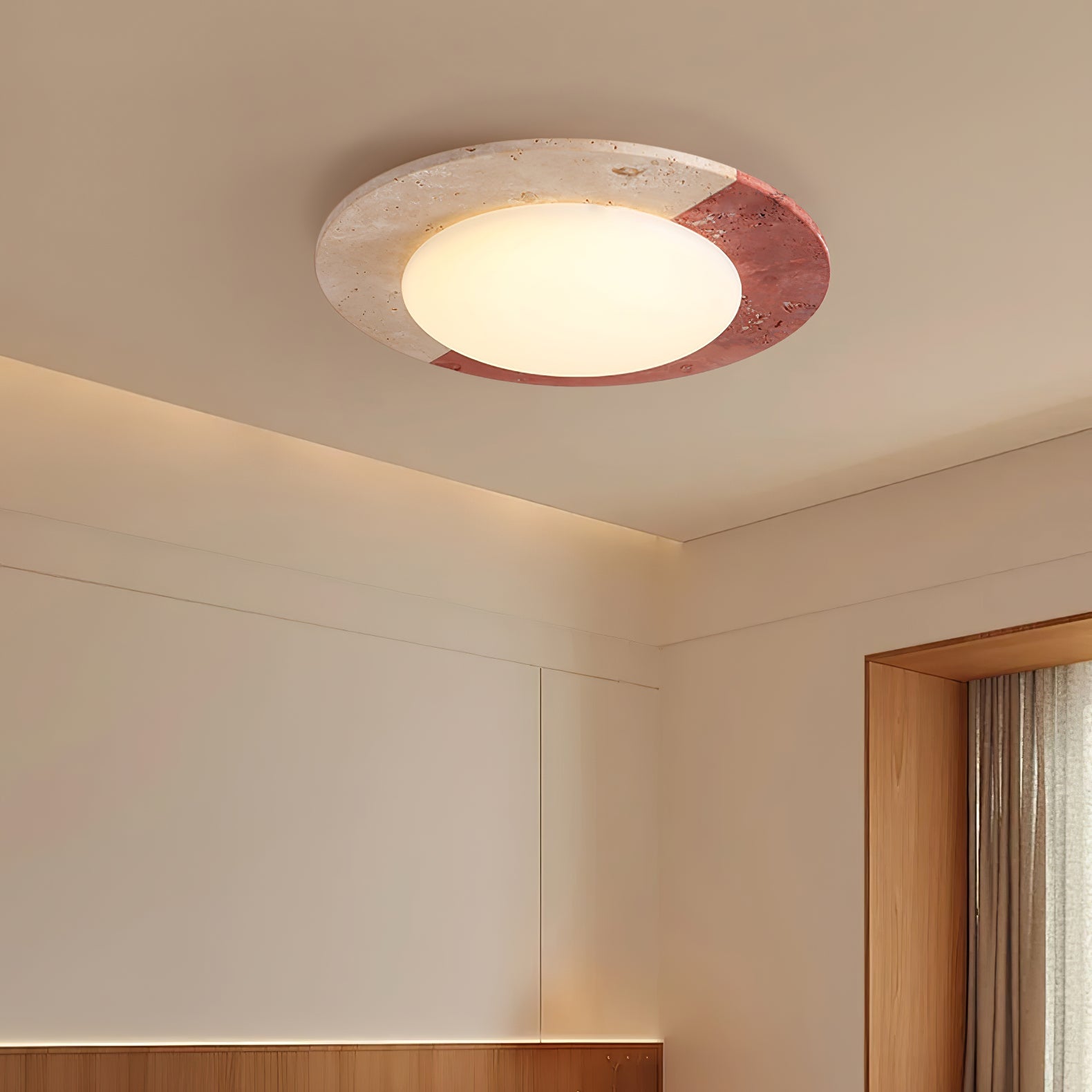 Nami travertine ceiling light 48cm installed in a dining room setting