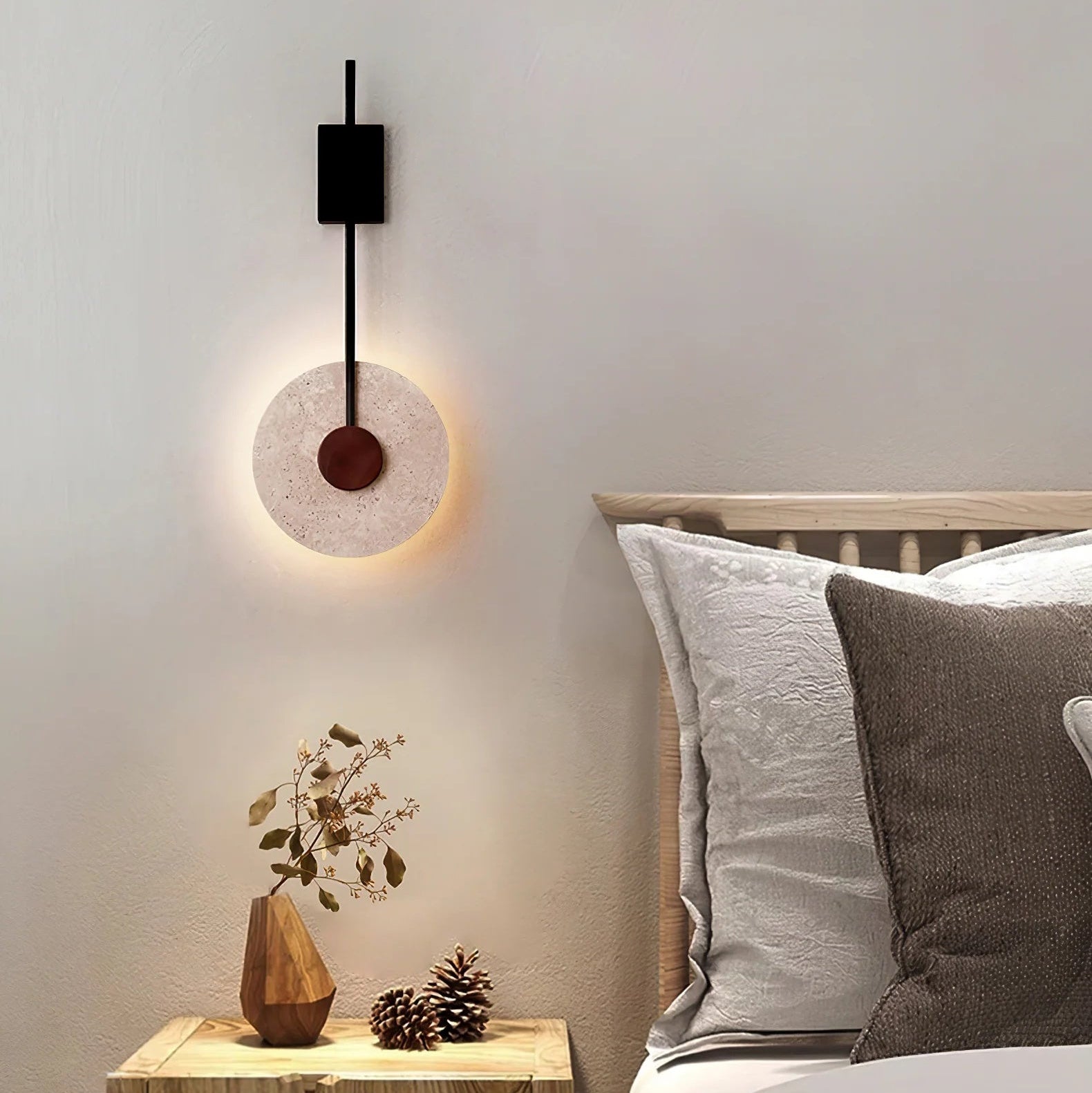 Full height view of the Tovi travertine wall light showing overall proportions