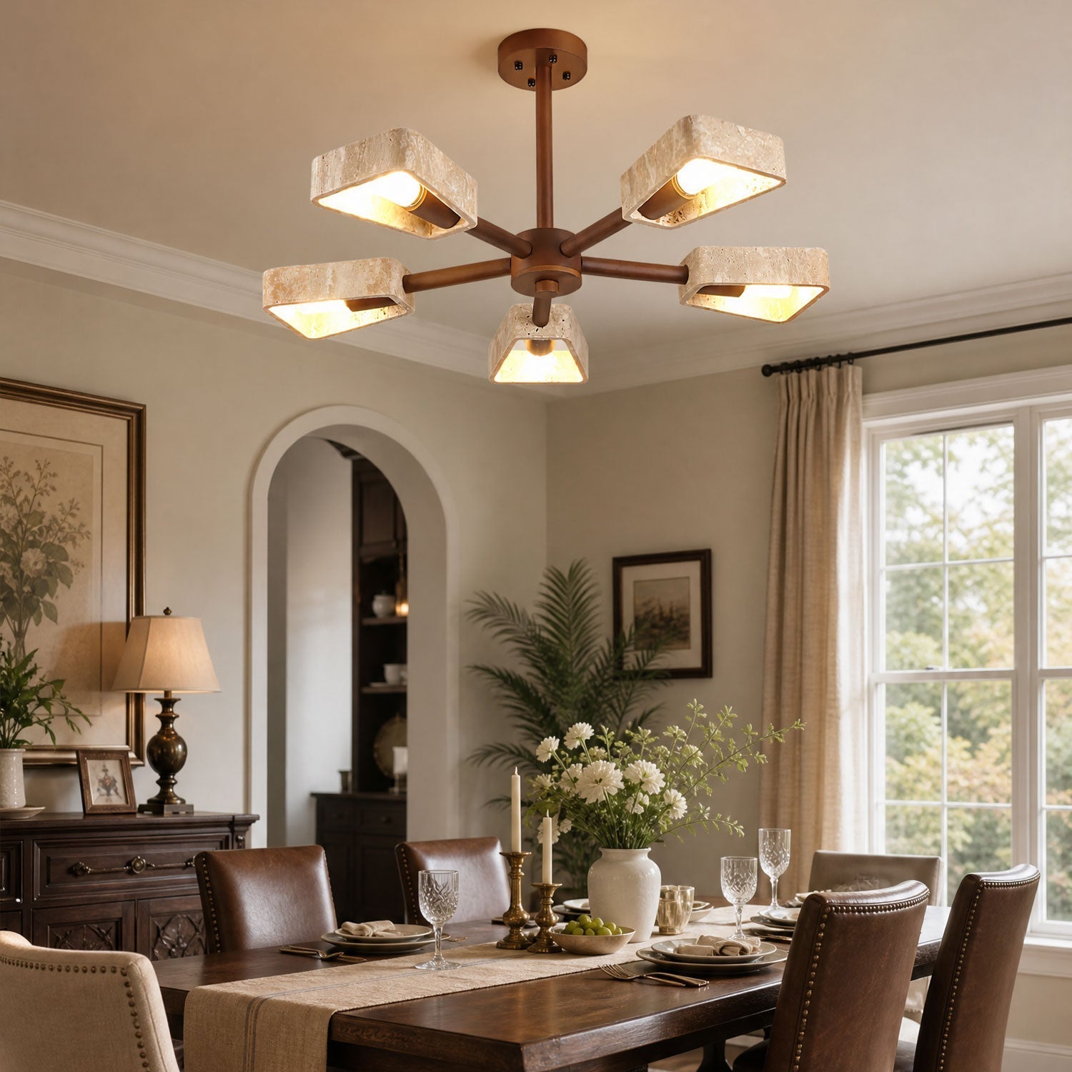 Tomoe Japandi chandelier casting soft warm light in a minimal dining room interior