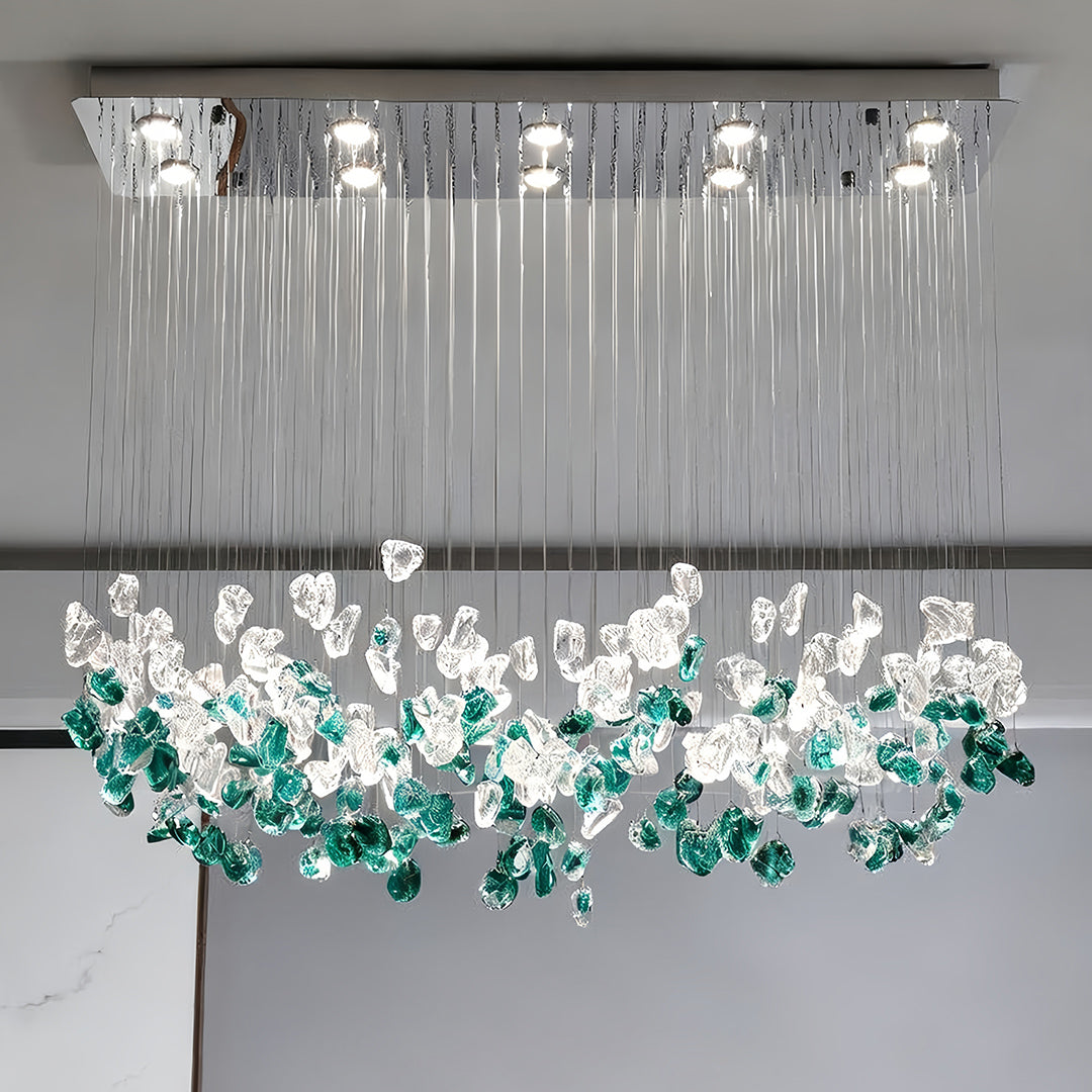 Auréline linear glass chandelier in a modern dining room, stainless steel ceiling mount