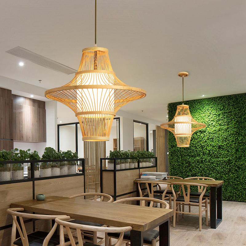 Aureon bamboo pendant light illuminated, warm ambient glow through open-weave shade