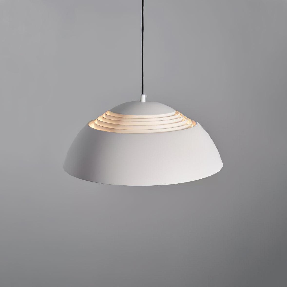Vantara drum pendant light in matte white in a calm neutral modern bedroom