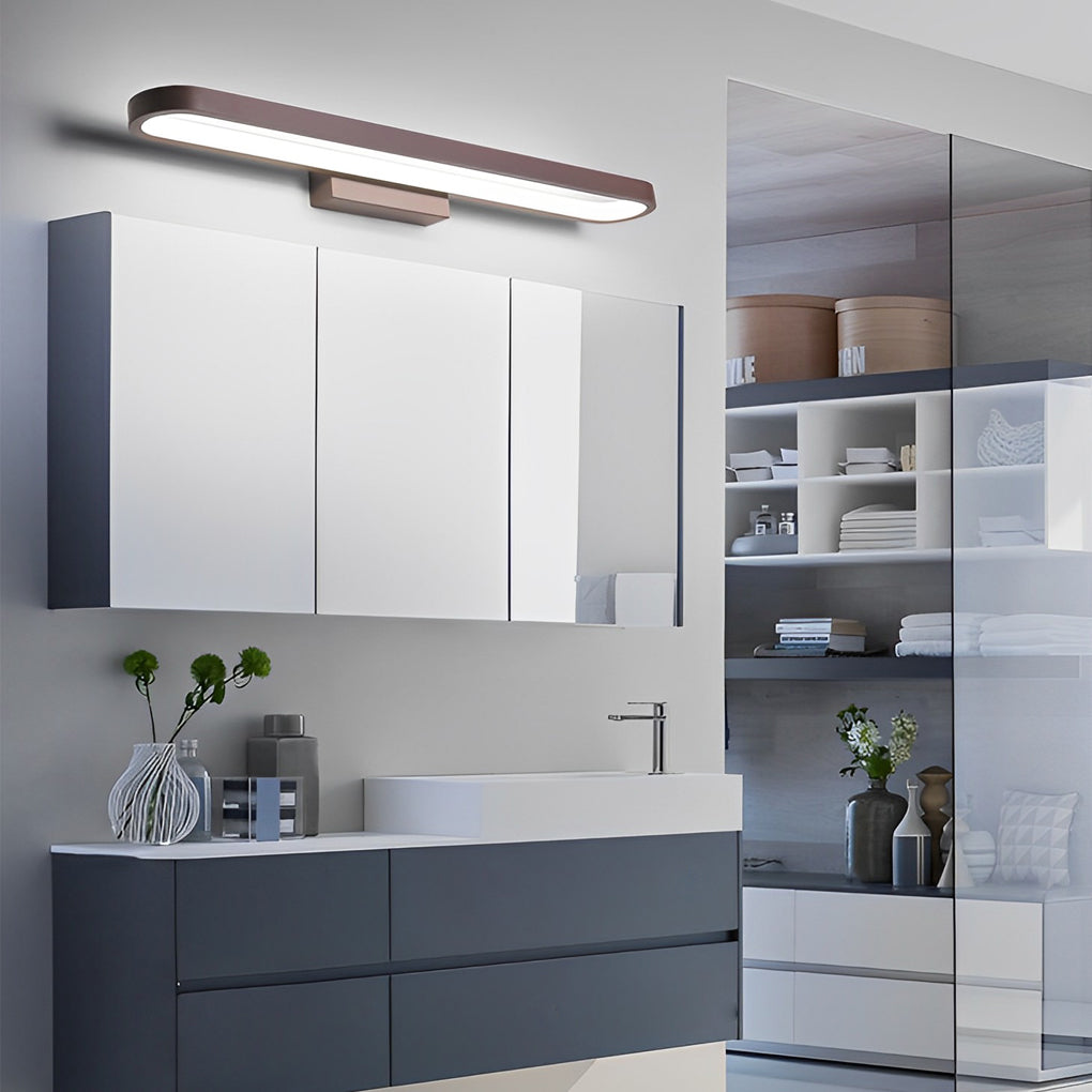 Viora LED vanity bar light mounted around bathroom mirror in a modern cabinet bathroom