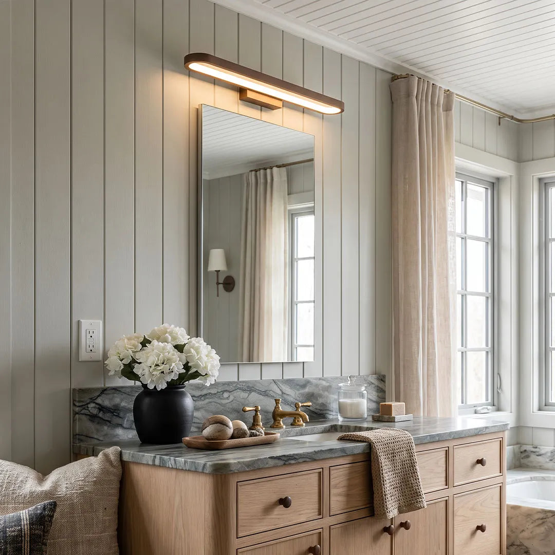 Viora LED vanity light above a wood-finish bathroom vanity unit