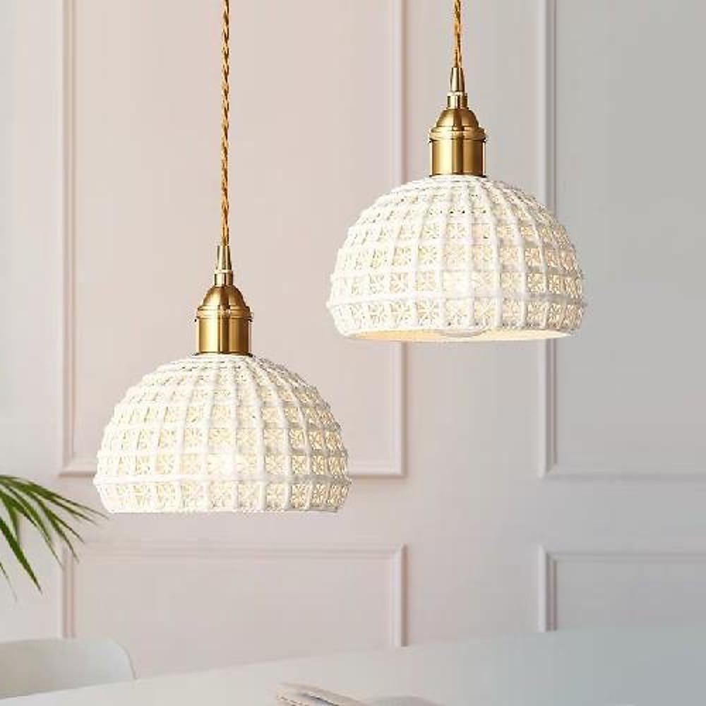 Aureon ceramic pendant light close-up showing dome shade and brass finish detail