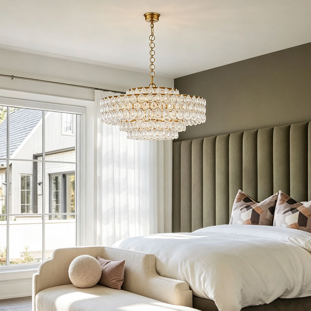 Modern crystal chandelier with copper frame above a bedroom, warm LED lighting interior