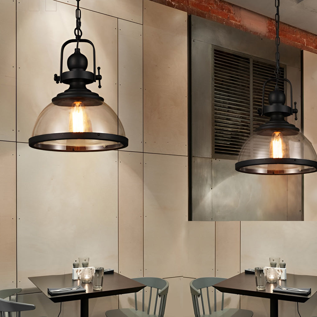 Clear glass industrial pendant light above a cafe counter setting