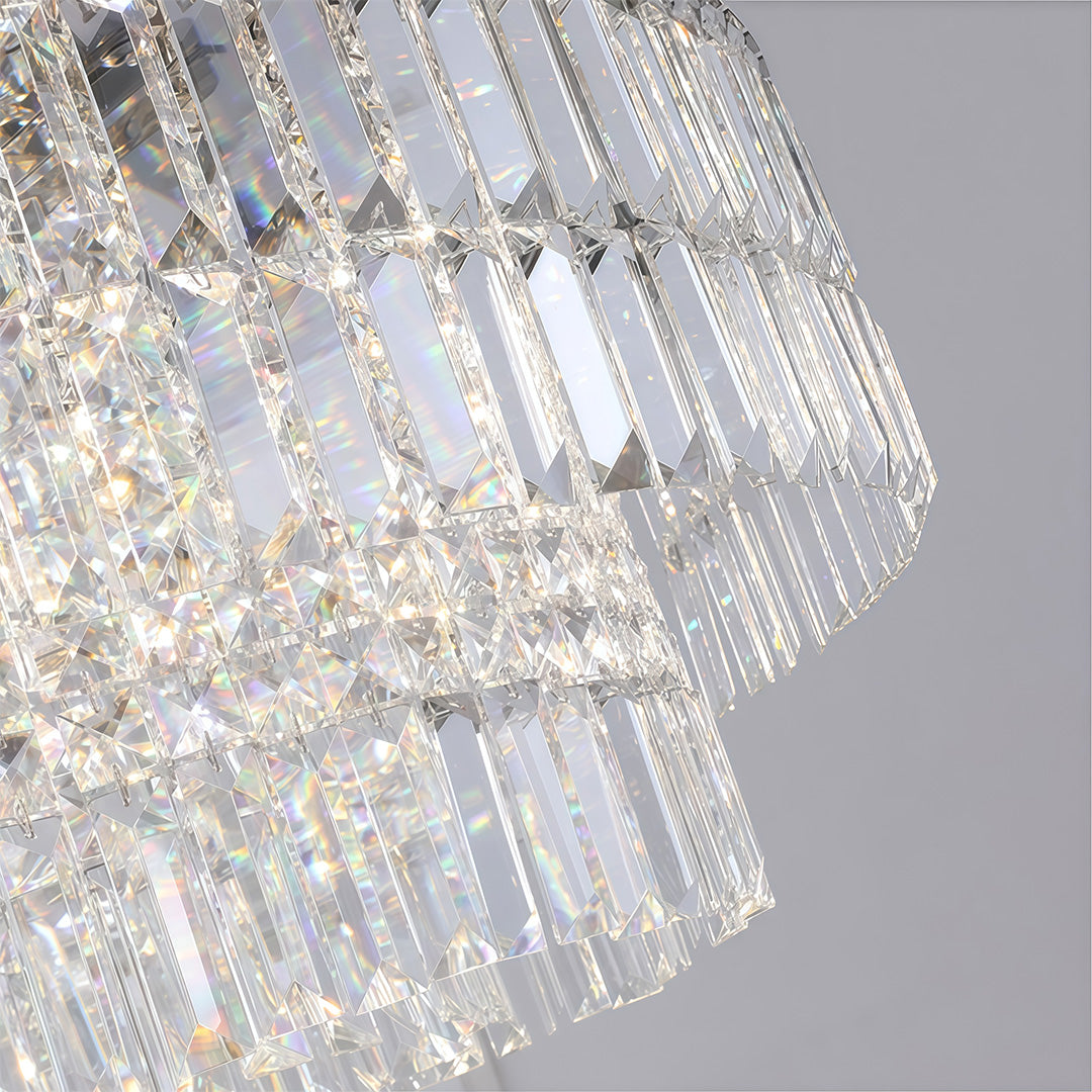 Close-up of round crystal chandelier drops, faceted prism crystals and layered construction detail