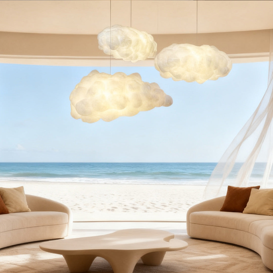 White cloud pendant light in a coastal-style living room interior