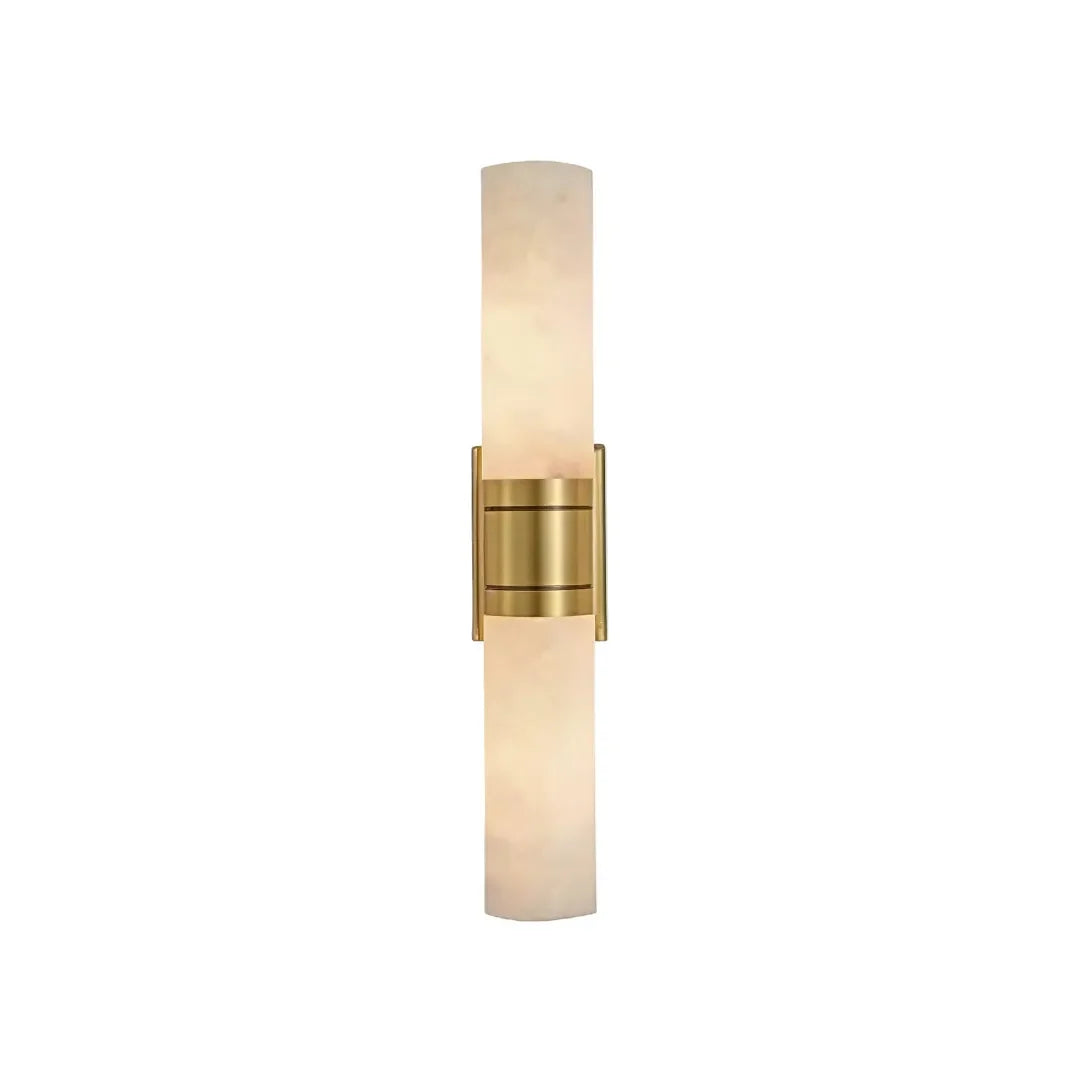 Niva marble wall sconce with brass gold accent band, warm light glowing through stone shade