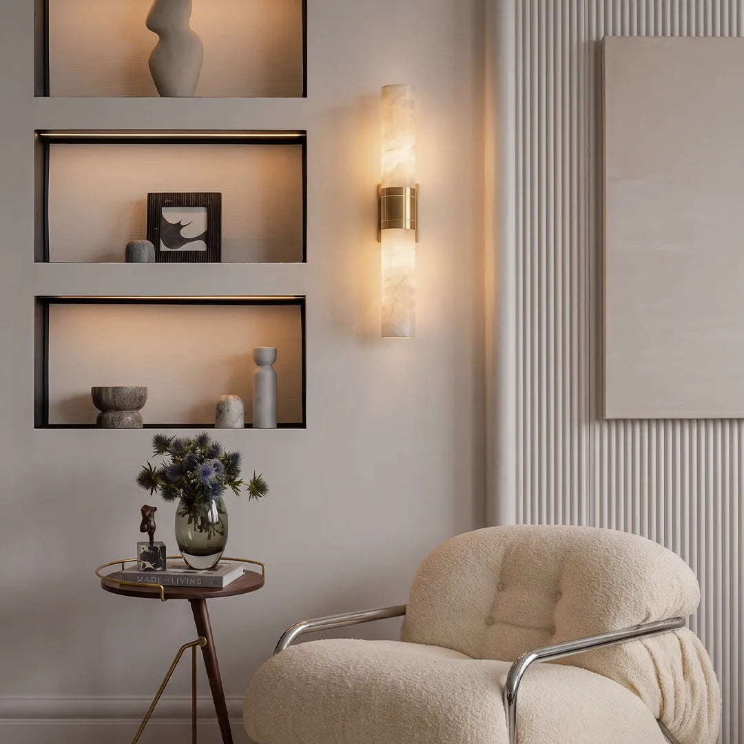 Niva marble wall sconce on a feature wall in a modern living room