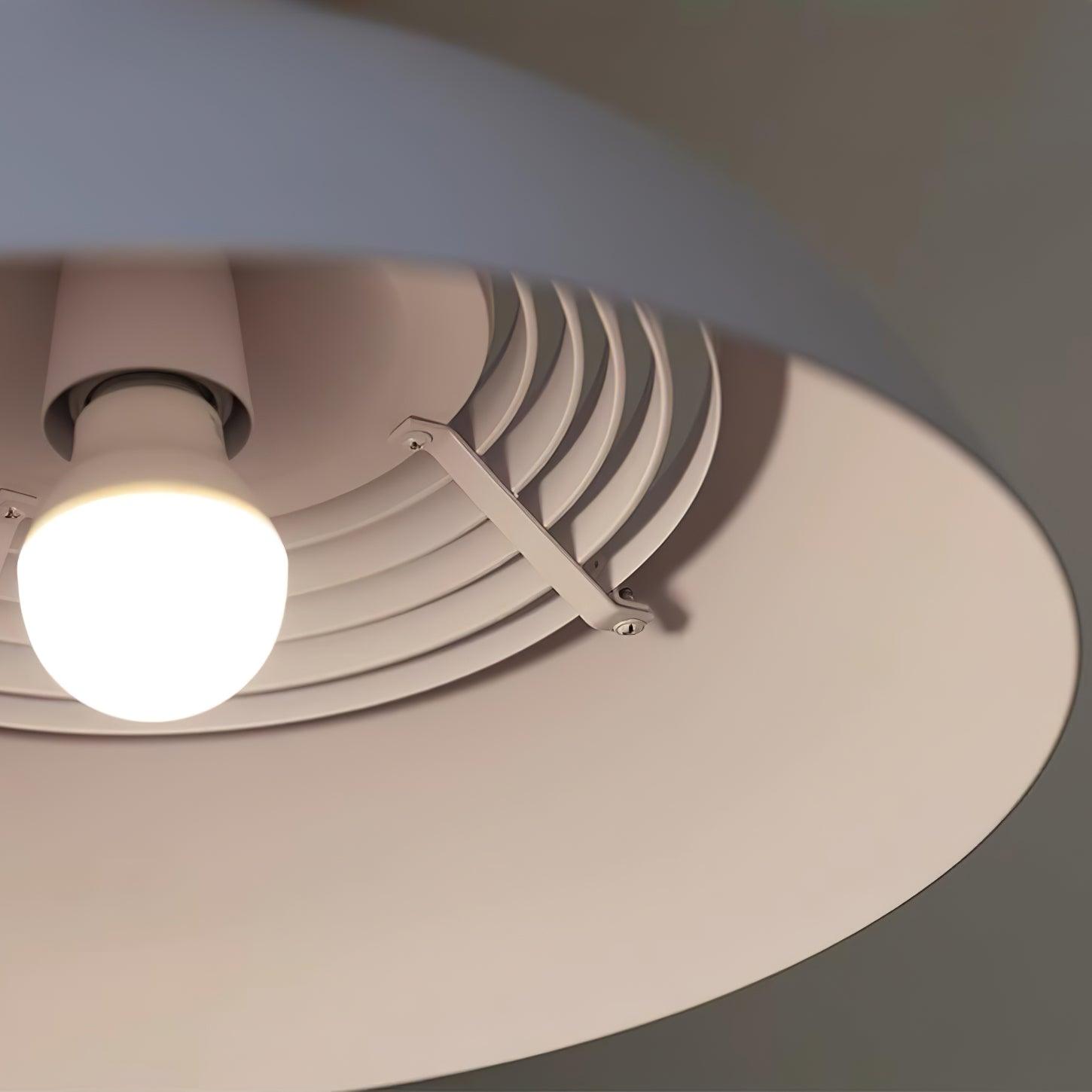 Vantara pendant light in matte white in a living room with neutral linen sofa below
