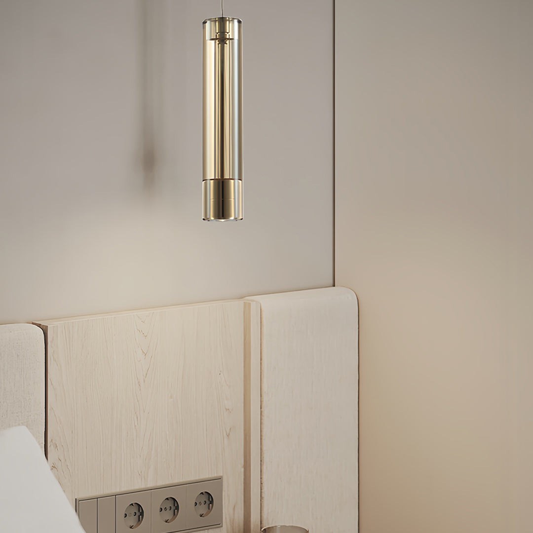 Double crystal pendant lights in a luxury bedroom with warm ambient glow