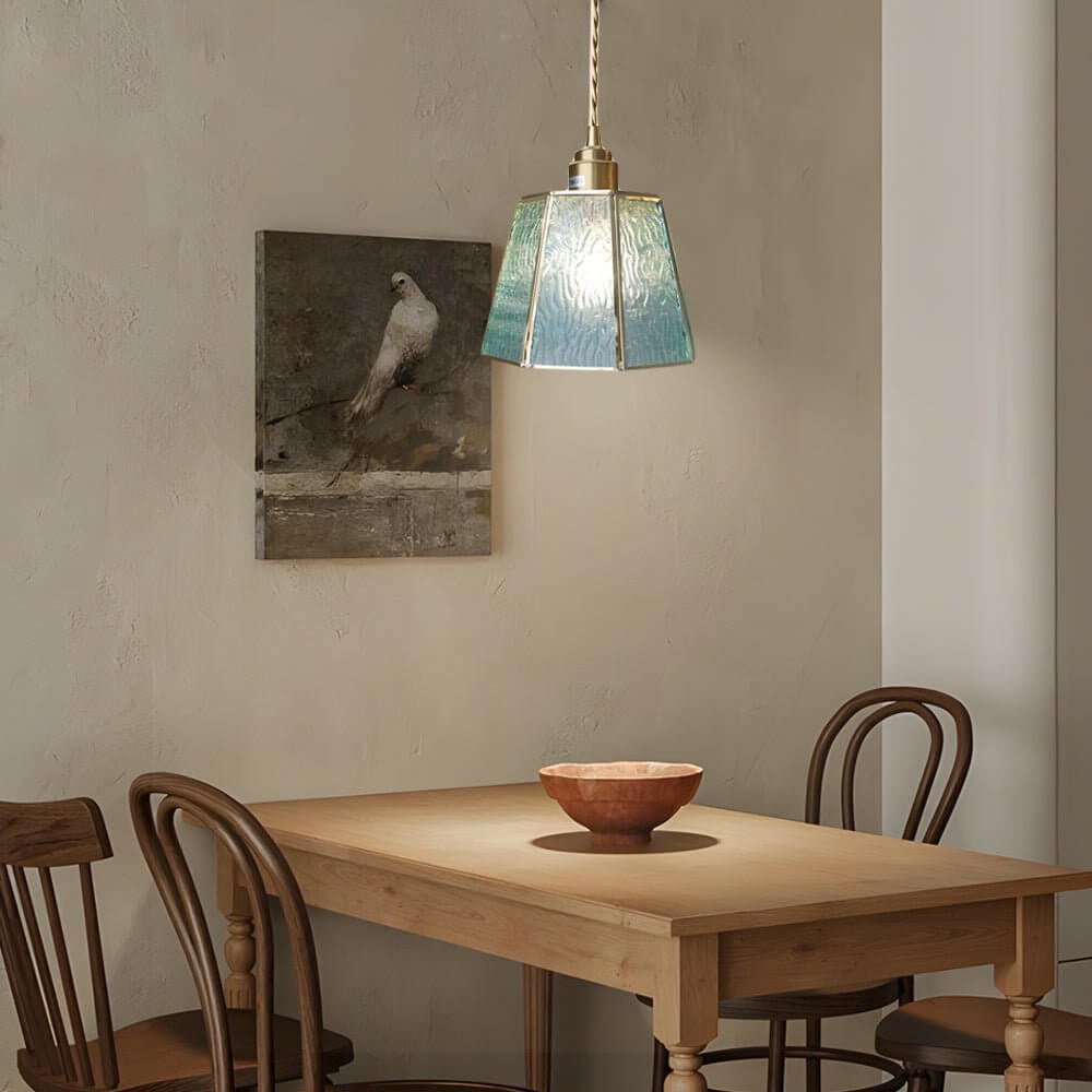 Aureon amber stained glass pendant light above a kitchen island in a contemporary home