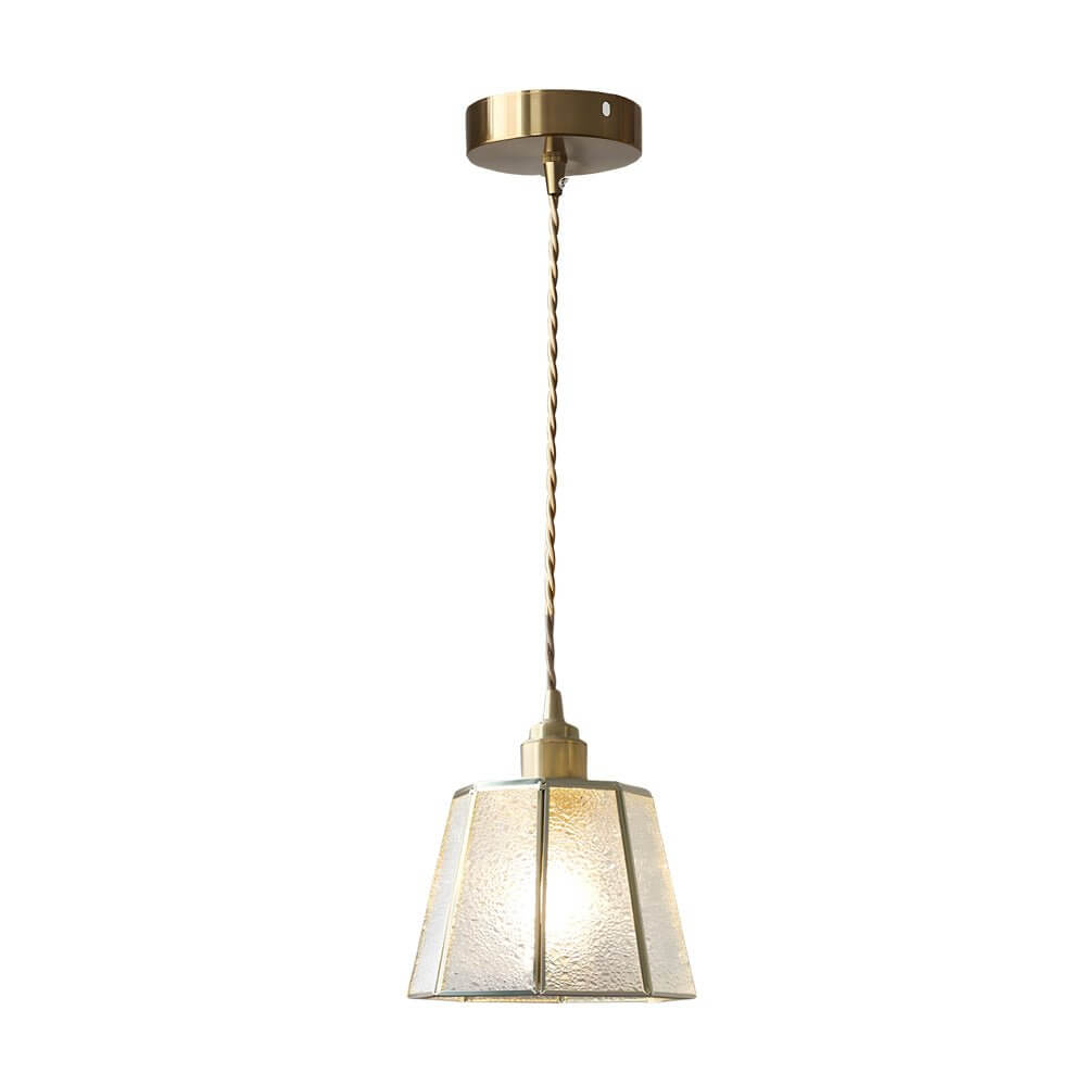 Aureon polygonal brass and stained glass pendant light in amber, hanging above a dining table