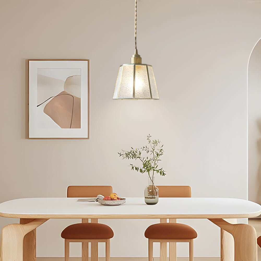 Aureon polygonal glass pendant light from below, showing faceted shade geometry and brass base