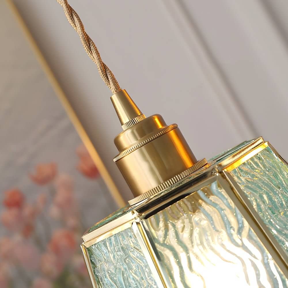 Aureon brass and glass pendant light dimension reference showing 5.9 inch width and adjustable rope