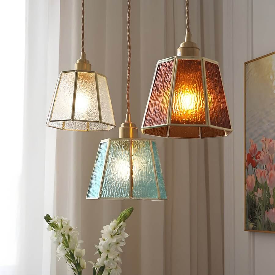 Aureon blue stained glass polygonal pendant light illuminated, showing warm ambient glow