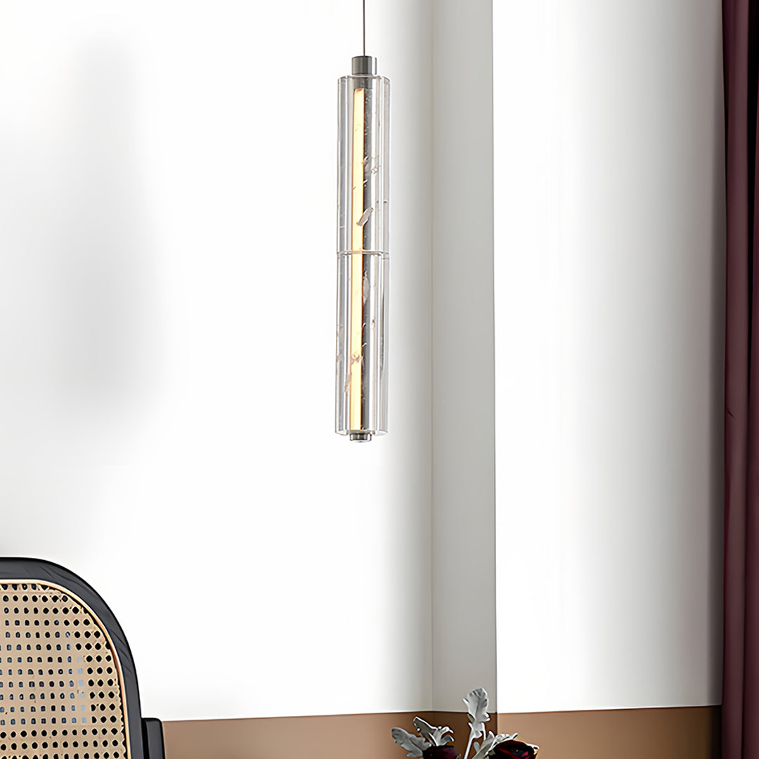 Aureon chrome crystal pendant light in a cozy corner setting beside an armchair and side table