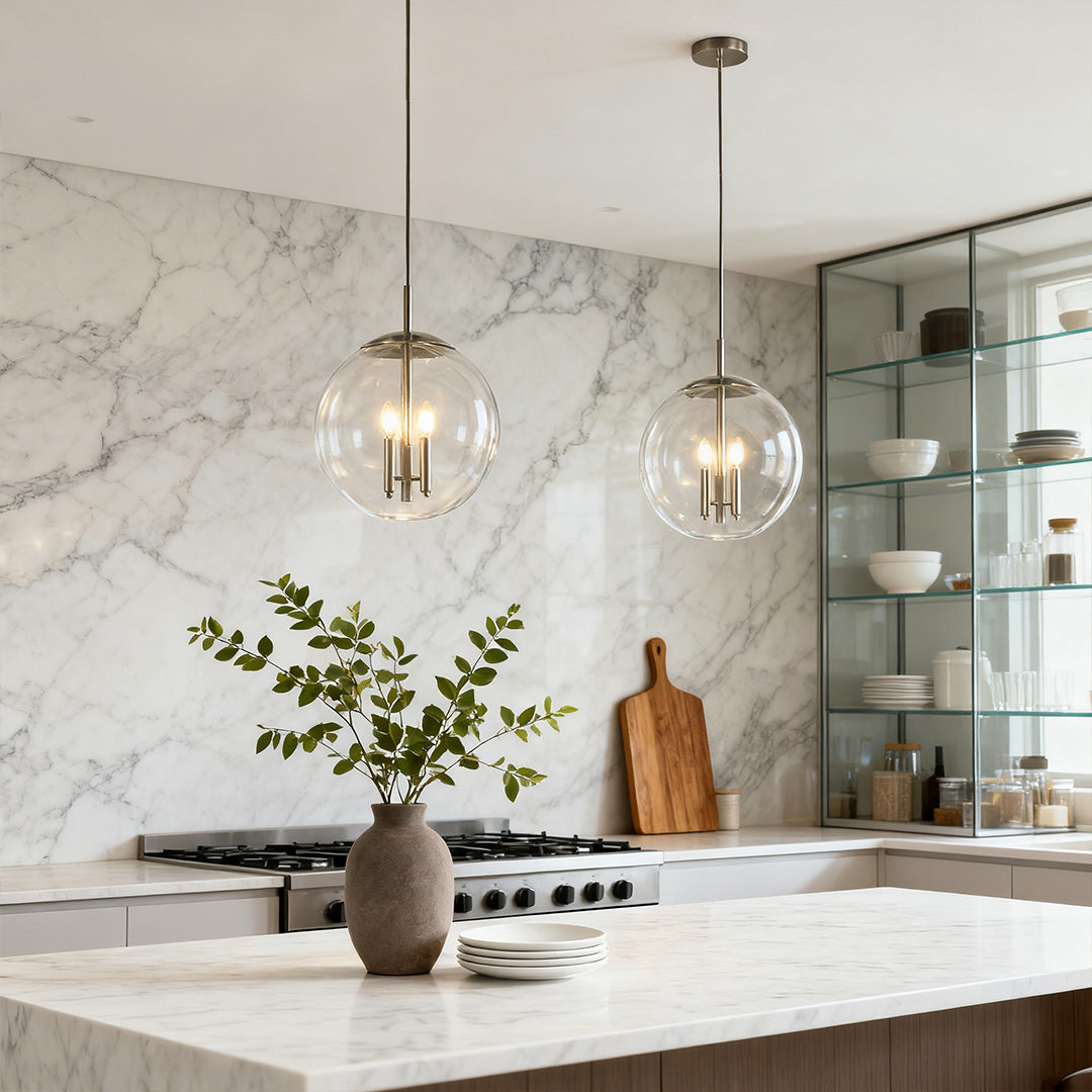 Single Aureon glass globe pendant light above a marble kitchen surface in a modern interior