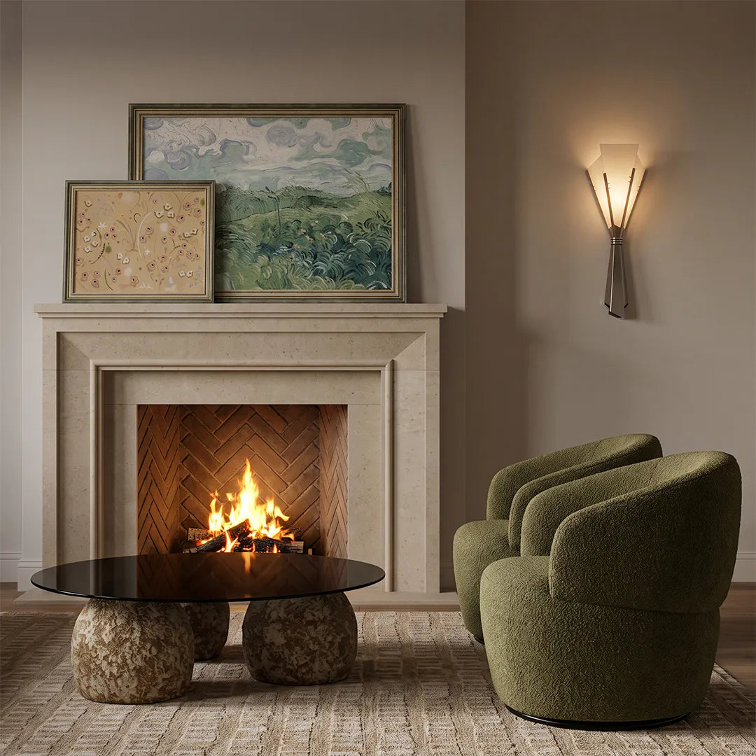 Niva marble wall sconce on a living room feature wall beside a fireplace