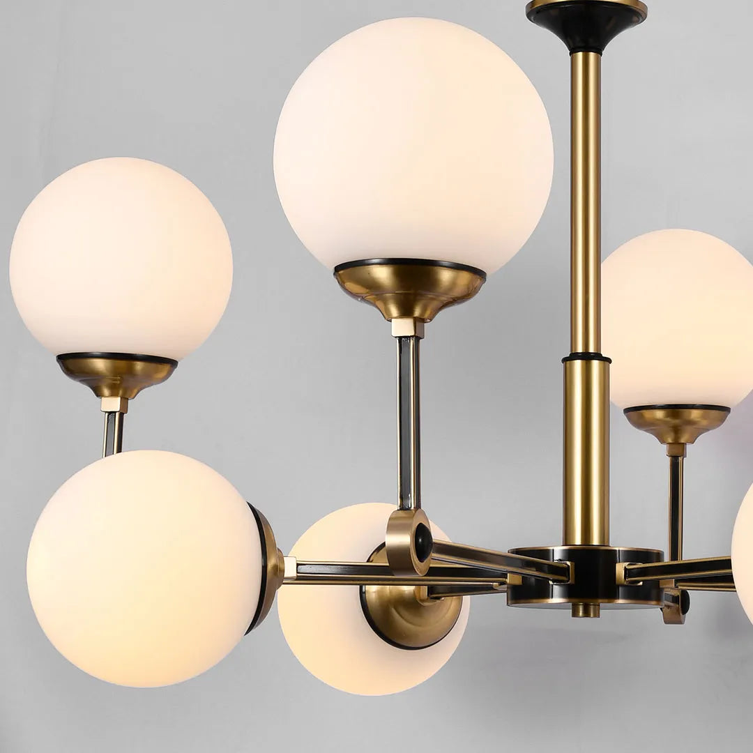 Close-up detail of frosted glass sphere shades on the Auréline chandelier