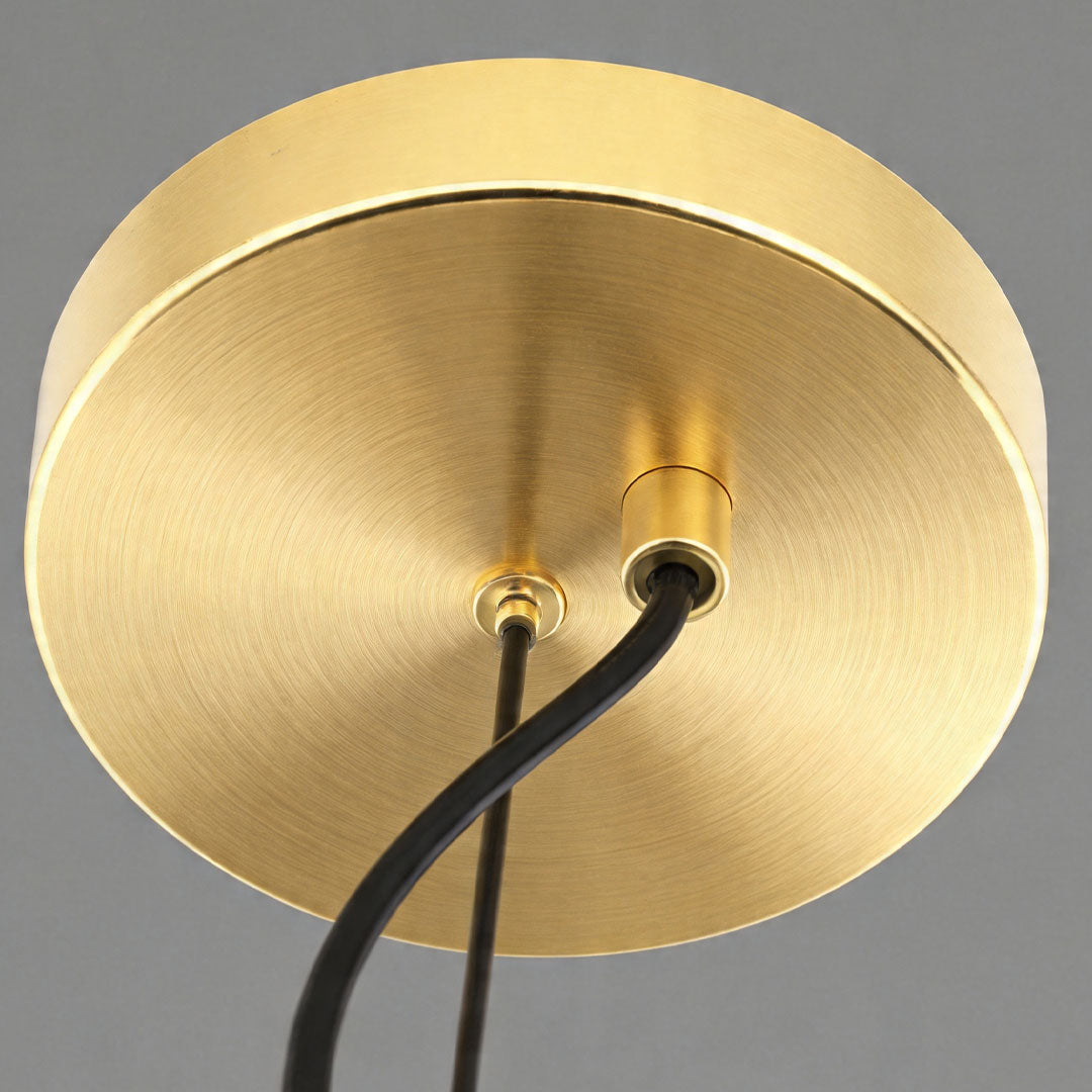 Brass-toned base detail of the Auréline glass globe chandelier ceiling mount