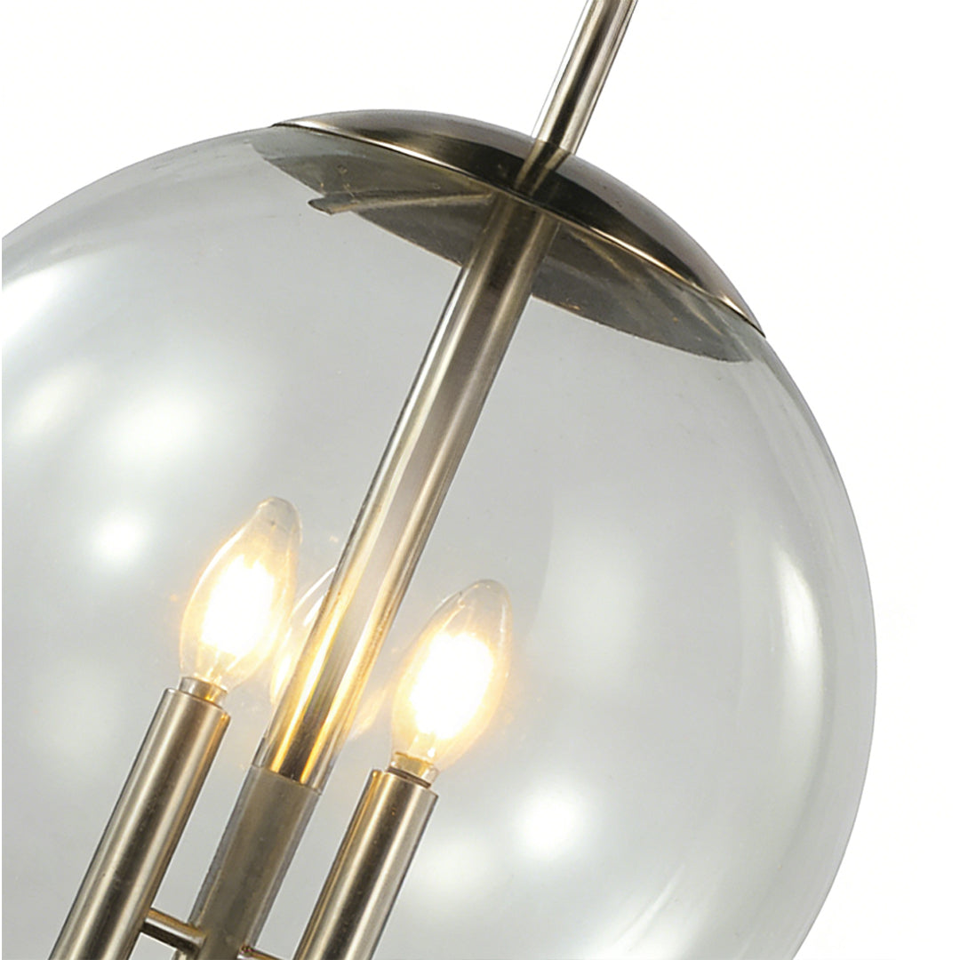 Close-up detail of the Aureon glass globe shade and silver metal frame construction