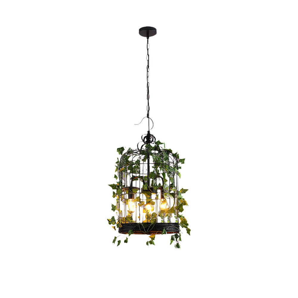 Close-up of Aureon pendant light artificial vine and eucalyptus detail with warm candle light