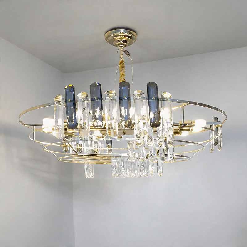 Auréline crystal chandelier illuminated and hanging from a glass ceiling fitting