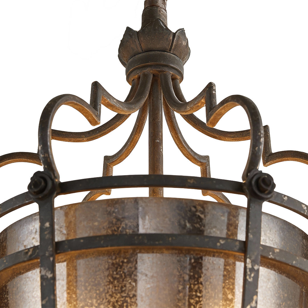Close-up of gothic lantern pendant light with bronze crown detailing and clear glass panels