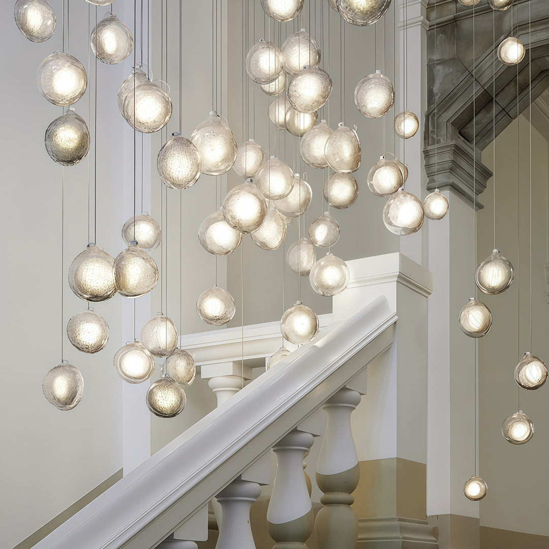 Modern sculptural jellyfish glass pendant ceiling light with transparent shade, contemporary interior