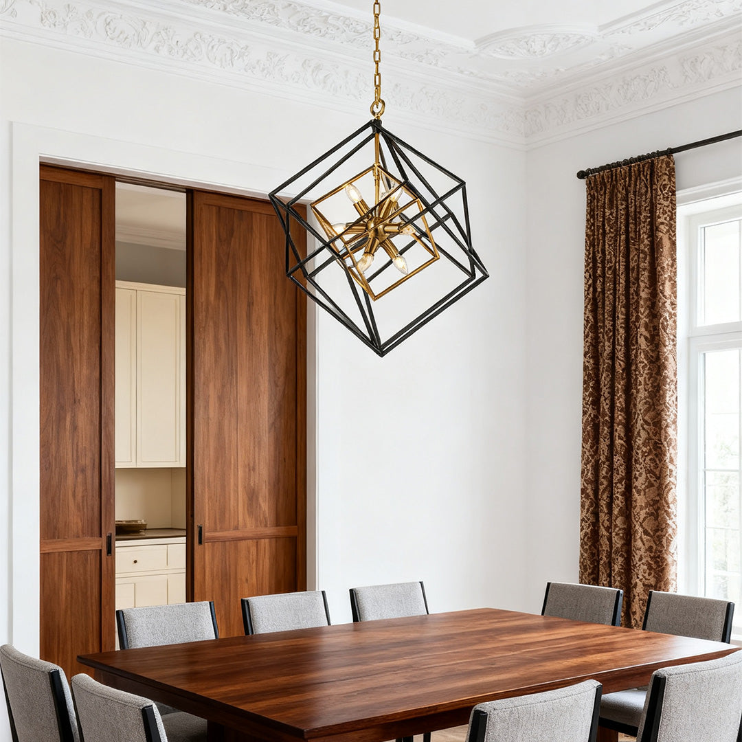 Aureon square geometric pendant light in black and gold above a wood dining table