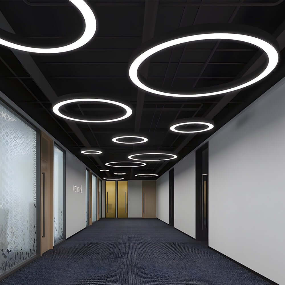Aureon round ring pendant ceiling light in white above a living room interior