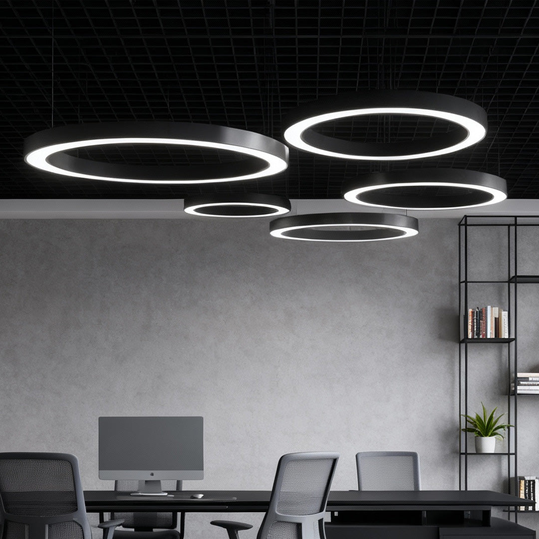 Aureon circular LED ceiling light in black above a contemporary dining area