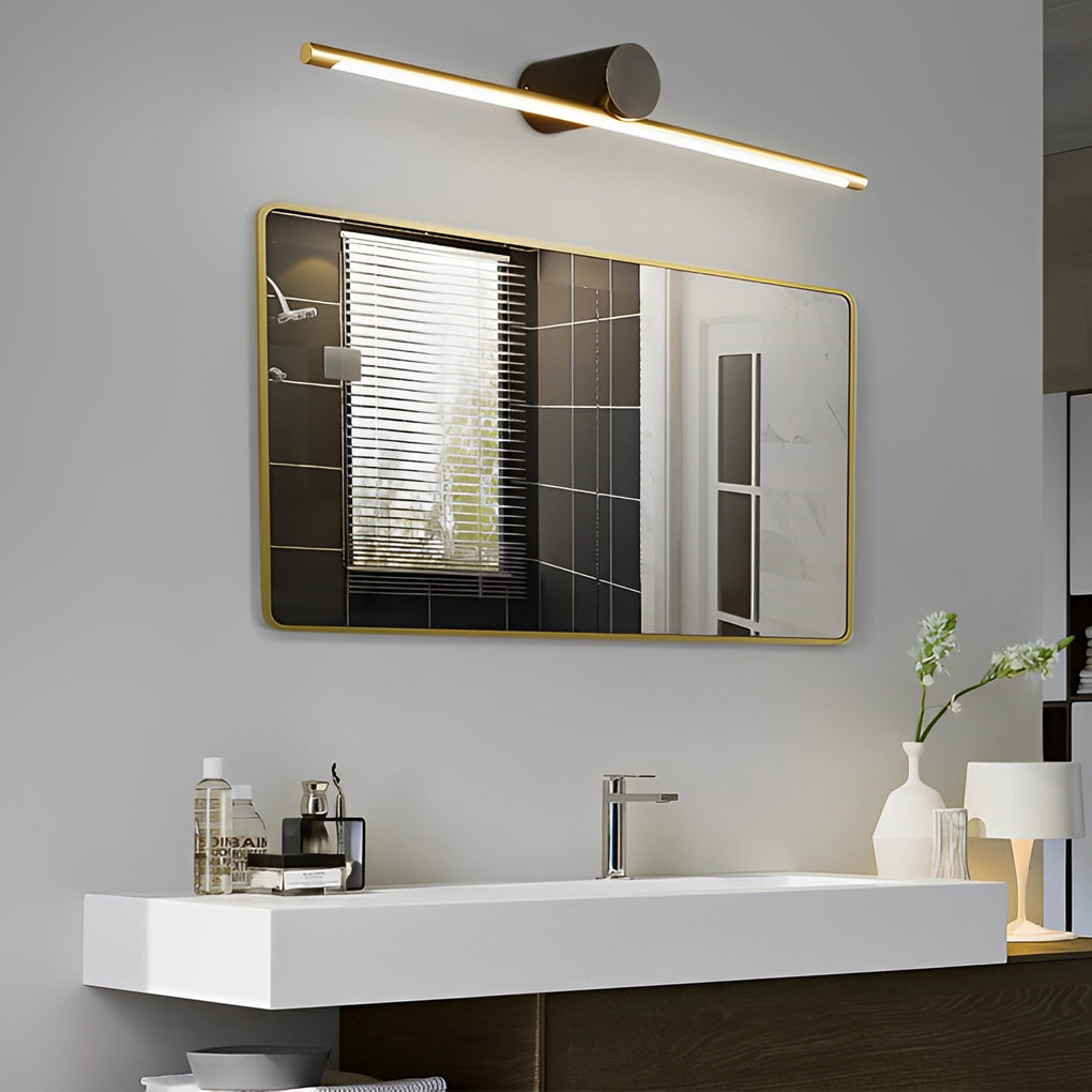 Viora linear LED vanity light bar in gold and black finish above a bathroom mirror